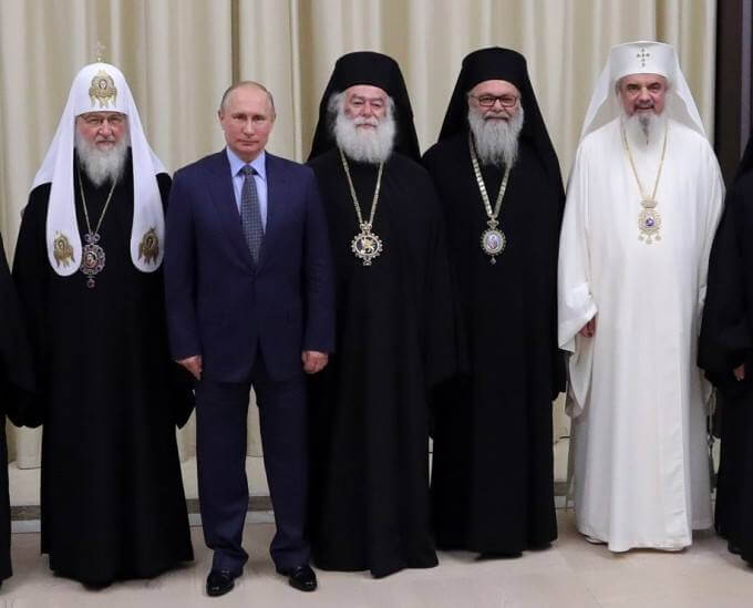Criminalul de razboi Putin, marele ortodox, alaturi de Kiril si Daniel